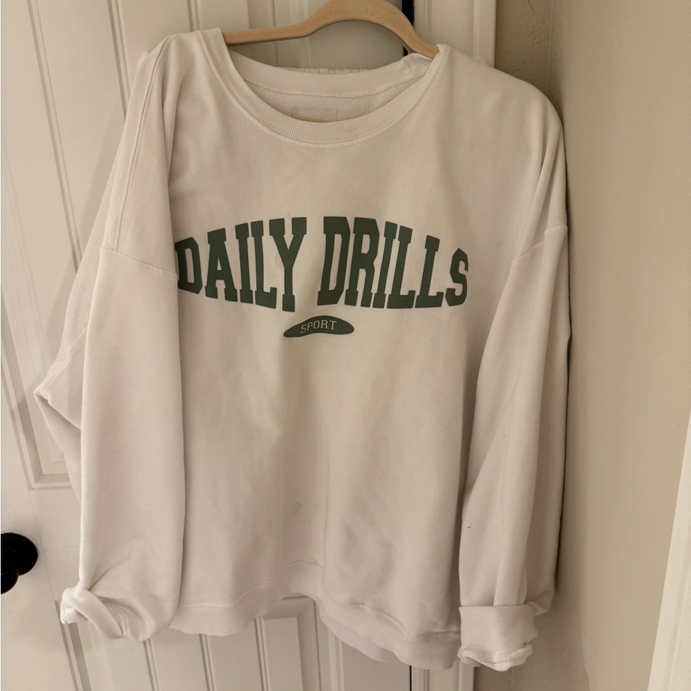 Daily Drills Sport crewneck. Small stains.